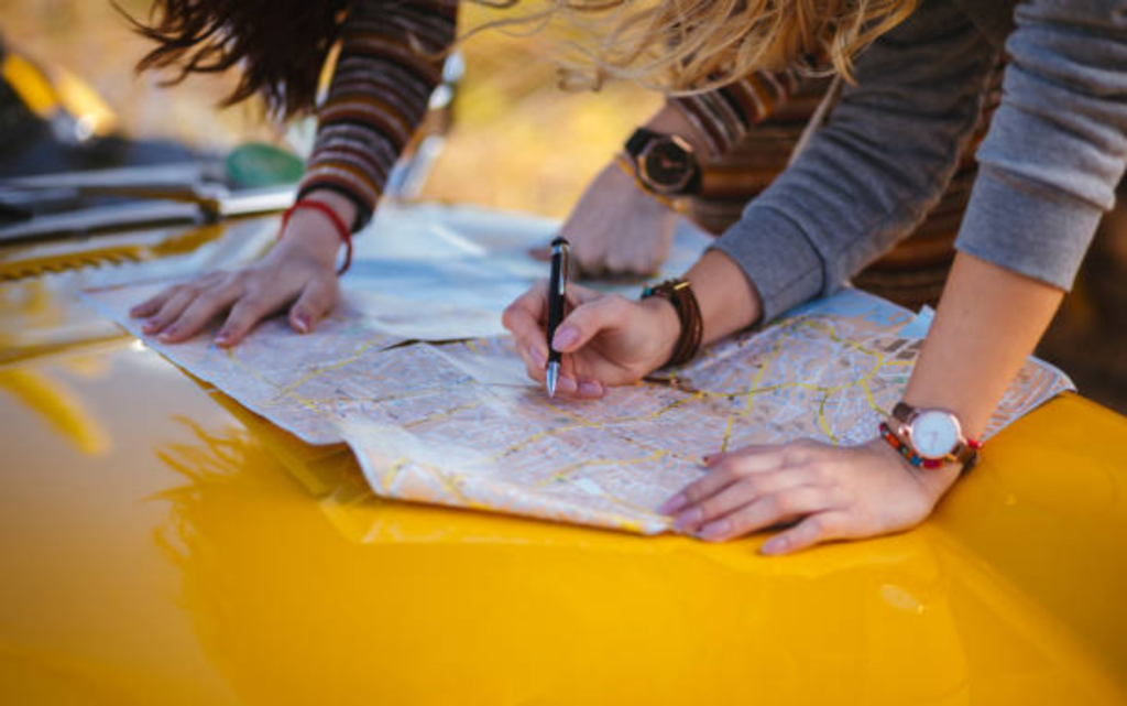 A stock image of two people working with a map.
